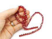 Margele cristal rotund fatetat 6mm rosu inchis AB (sirag)