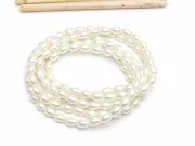 Perle de sticla ovale 6x4mm ivory (sirag)