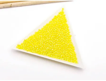 Toho rotunde 11/0 transparent wild yellow rose (5g)