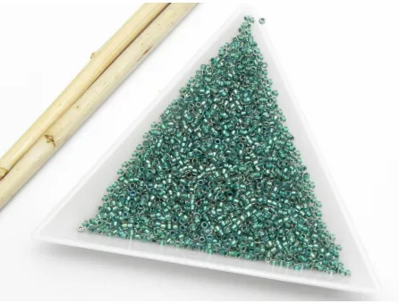 Toho rotunde 15/0 inside colro rainbow crystal teal lined (5g)