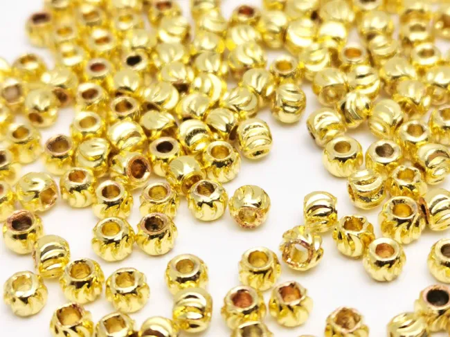 Margele de alama decorative cu striatii 3x2mm placate cu aur 14K  (10buc)