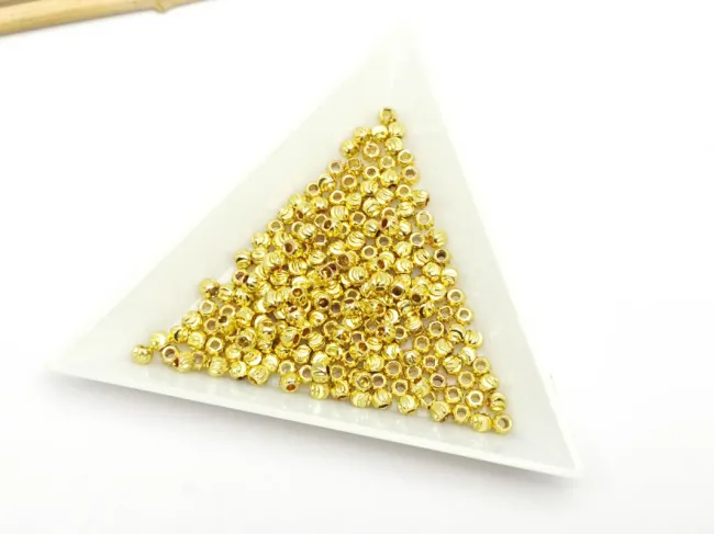 Margele de alama decorative cu striatii 3x2mm placate cu aur 14K  (10buc)