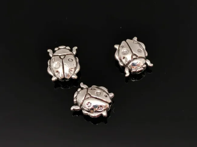 Margele metalice 10x8.5mm buburuza