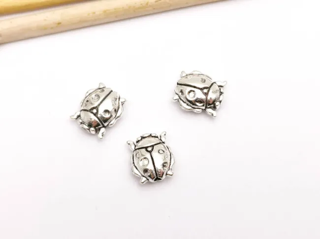 Margele metalice 10x8.5mm buburuza