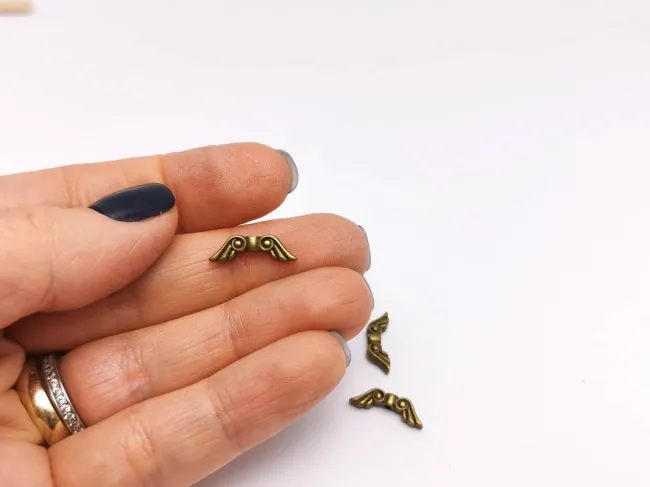 Margele metalice aripi 15x5mm bronz