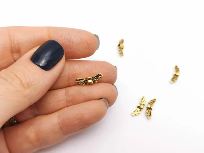 Margele metalice aripi 13x4mm auriu