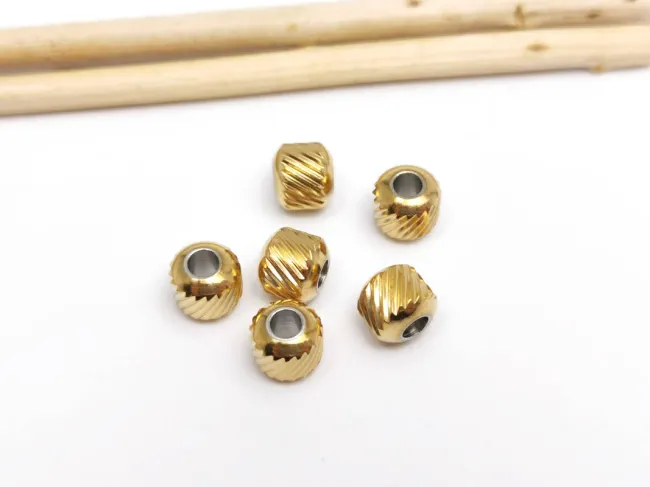 Margele otel inoxidabil 201 auriu cu striatii 6x5.5mm