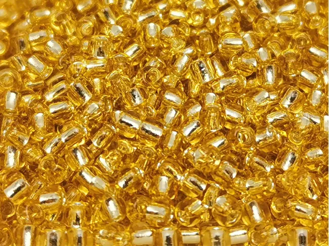Toho rotunde 11/0 silver lined lt topaz (5g)